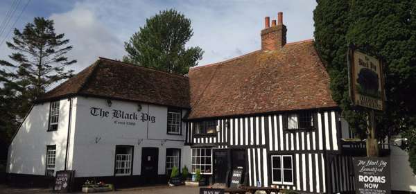 The front entrance to the Black Pig with half black and white timbered building