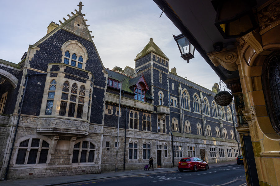 Impressive flint fronted Gothic exterior of Maison Dieu