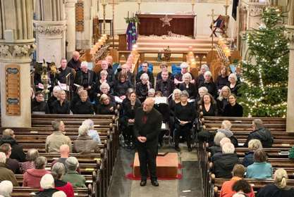 Photo of choir singing at a Christmas Concert