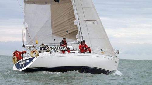 A close up of a yacht and crew out at sea