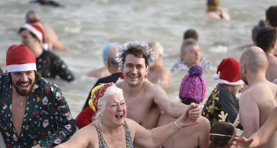 People in the water enjoying a boxing day dip