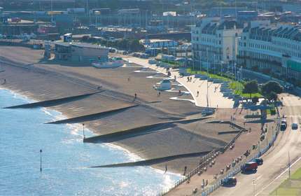 Dover beach and esplanade from above, with the watersports centre and part of the Marina Spa hotel visible