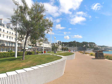 Dover Esplanade with Dover Castle and the port in the distance.