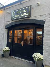 Photo of the exterior of It’s The Real Deal