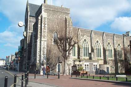 Exterior of Maison Dieu in Dover showing the large arched stained glass windows.