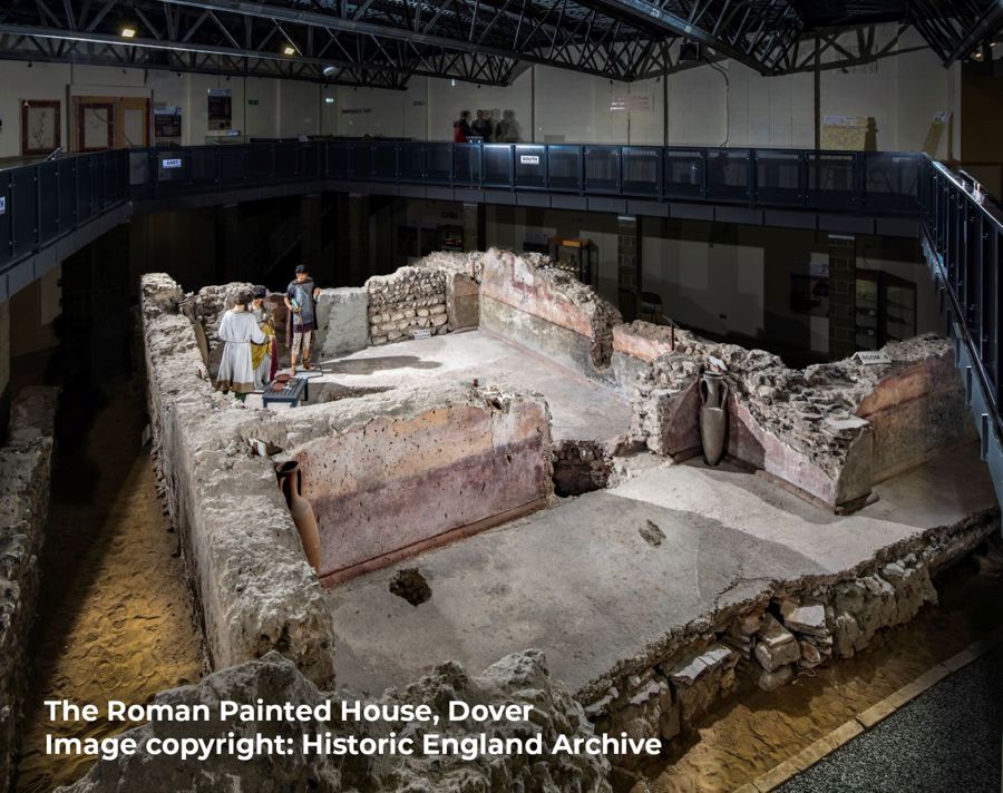 Looking down on the remains of a Roman house with painted walls.